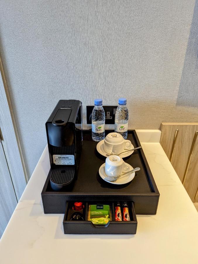Апарт отель Citadines Абха Экстерьер фото A Nespresso coffee machine in a hotel room